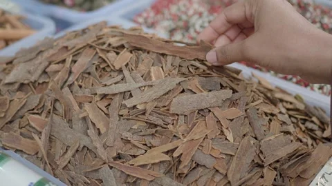 Cinnamon Bark Beautifully Displayed at a Vibrant Market Stall, Exotic Spice Stock Footage 292197722