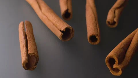 Cinnamon bark on the grey table Video stock 140008602