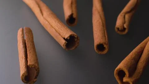 Cinnamon bark on the grey table Stock Photos