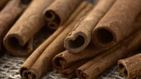 Cinnamon bark sticks low angle shallow depth of field rotating Stock Footage 86904067