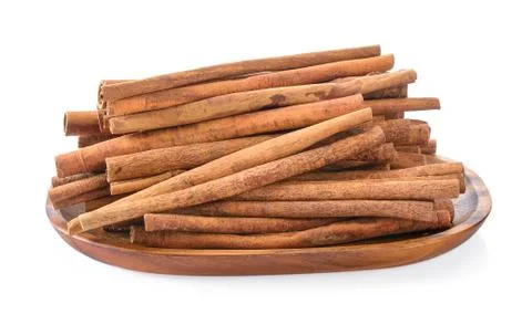 Cinnamon in basket on white background Stock Photos