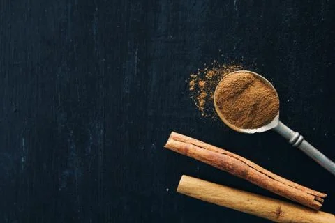 Cinnamon on black background Stock Photos