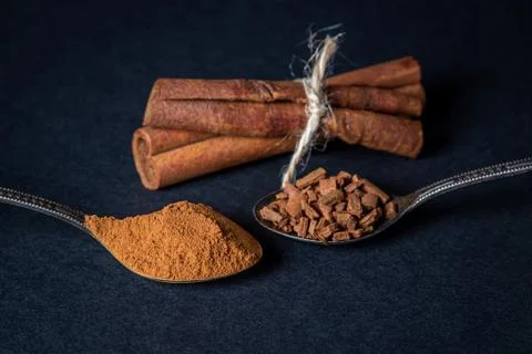 Cinnamon on a black background.  Stock Photos