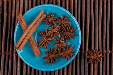 Cinnamon on blue plate Stock Photos