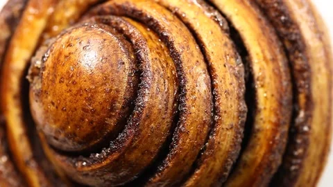Cinnamon bun round rotates, top view Stock Footage