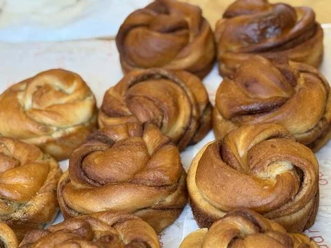 Cinnamon buns arranged on a table showcasing freshly baked texture and warm.. Stock Photos