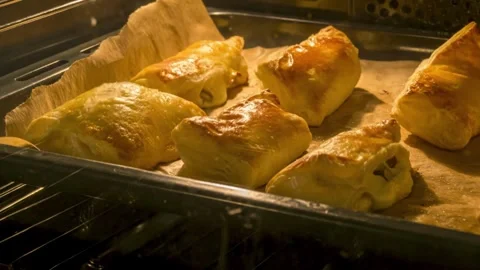 Cinnamon buns baking and rising in the oven. Zoomed-in timelapse view. Homemade Video stock 336576653