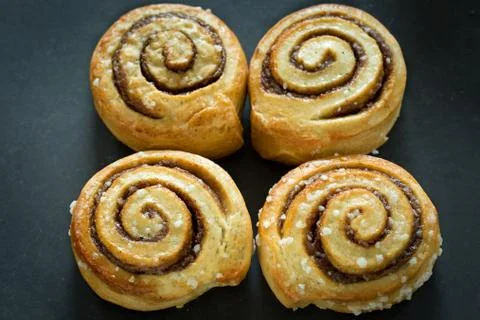 Cinnamon buns on rustic baking plate Stock Photos