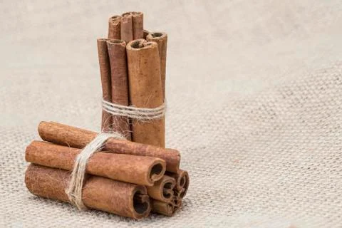 Cinnamon on a burlap Stock Photos