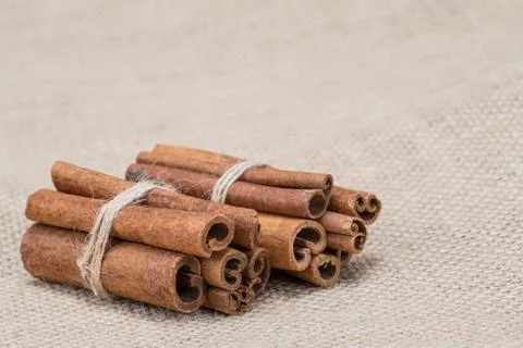 Cinnamon on a burlap Stock Photos