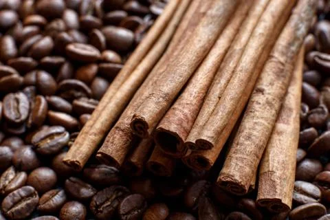 Cinnamon on coffee beans close-up Stock Photos