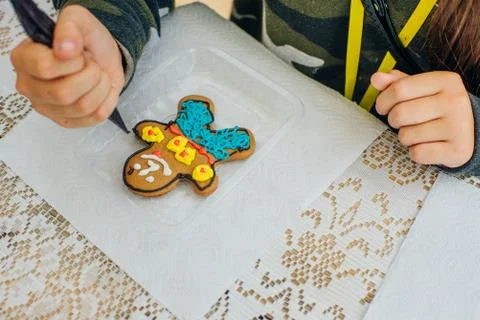 Cinnamon cookies icing decorating process with a pastry bag Stock Photos