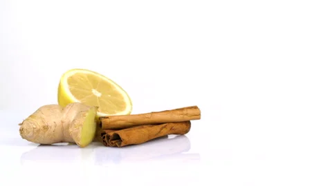 Cinnamon, Lemon and Ginger turning on white background Stock Footage 171666530