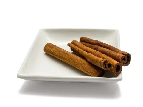 Cinnamon in plate Stock Photos