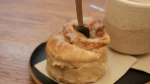 Cinnamon roll and latte. Stock Footage 292788788