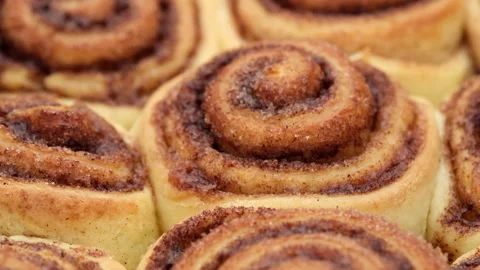 Cinnamon rolls close up. baked cinnamon buns. Production of cinnamon rolls Stock Footage 143458282