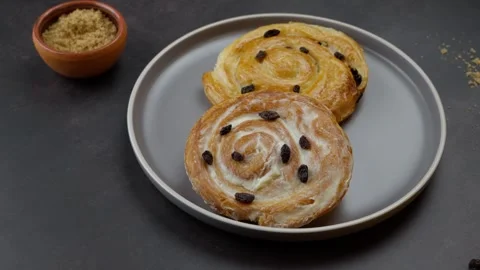Cinnamon rolls, Dolly back Dark background Stock Footage 278608635