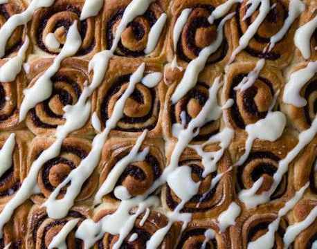 Cinnamon rolls with icing Stock Photos