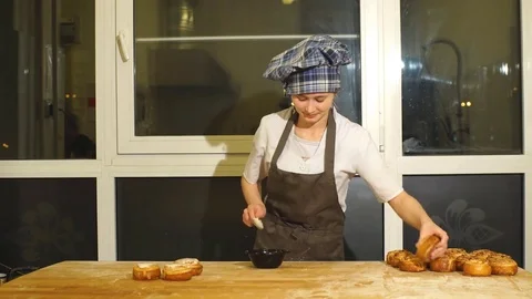 Cinnamon rolls sprinkled with icing Stock Footage 74072154