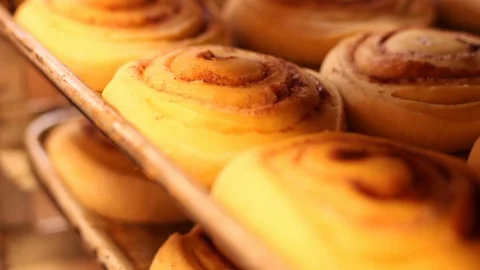 Cinnamon rolls on a tray before baking 스톡 동영상 130086292