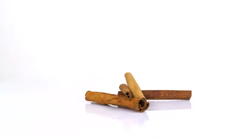 Cinnamon rotating on white background Stock Footage 171655403