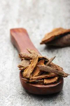Cinnamon in spoon close up Stock Photos