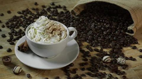 Cinnamon Sprinkled on Cafe Latte Stock Footage 141533939