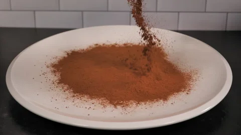 Cinnamon is sprinkled onto platter in slow motion. Stock Footage 140267565
