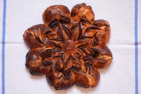 Cinnamon star bread on a white table cloth Stock Photos