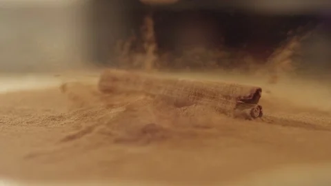 Cinnamon stick fall on cinnamon powder RAPID 100fps (FEW SHOTS) Video stock 74653545