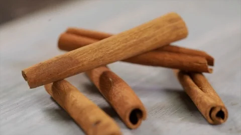 Cinnamon stick falls on other Cinnamon sticks Closeup No. 1 Stock Footage 99165853