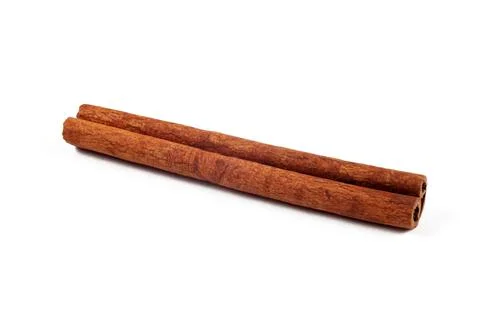 Cinnamon stick on a white background, isolate, close-up. Stock Photos