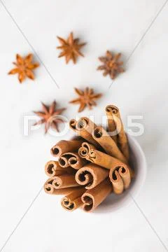 Cinnamon sticks and anise stars. Stock Photos