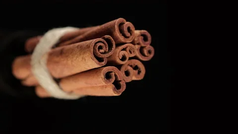 Cinnamon sticks on black background. Vertical video Stock Footage 168081433