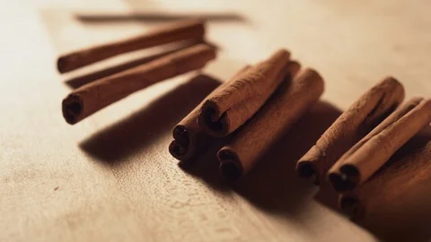 Cinnamon sticks falling on a table. Slow Motion. Stock Footage 121436610