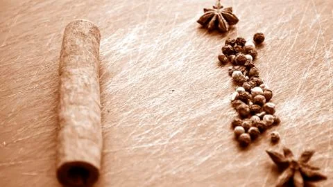 Cinnamon sticks lying on the table in the kitchen. Seasoning for Stock Photos