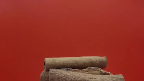 Cinnamon sticks on a red background. Stock Footage 287915533