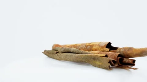 Cinnamon Sticks Rotating on White Background Isolated Stock Footage 325347840