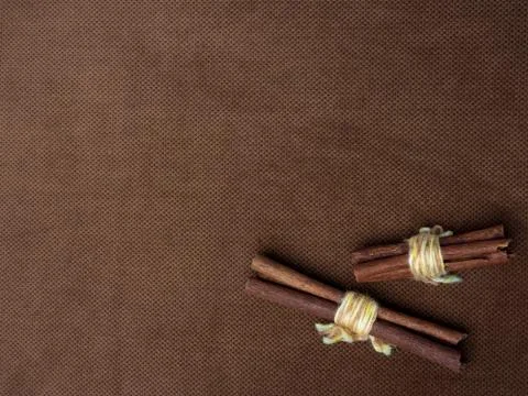Cinnamon sticks tied with string. Photos