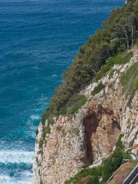 Cinque Terre typical steep cliff pine trees and rocks Stock Photos