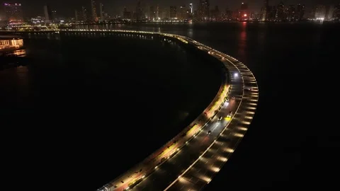Cinta Costera Bridge Road and Panama City Night Lights Skyline Rising Drone View Видео 339709644