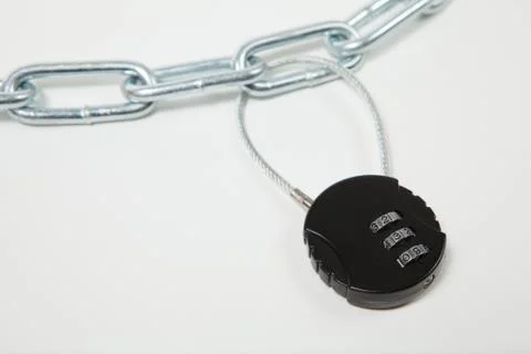 Cipher padlock on chain on white background. Security concept. Stock Photos
