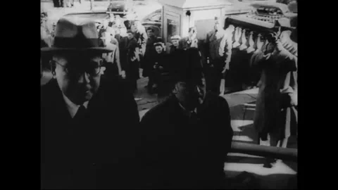 CIRCA 1940: Officials and crowds gather during Axis-pact-era diplomacy Stock Footage 339065409