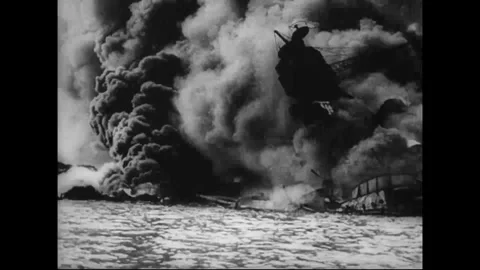 CIRCA 1941: Massive black smoke billows over water Stock Footage 339065399