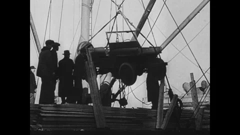 CIRCA - 1943: Shows staged equipment awaiting shipment at a dock Vídeos de archivo 339215896