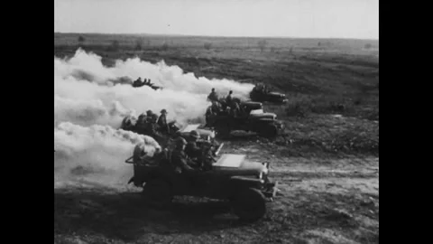 CIRCA - 1943: Shows troops advancing on foot across a field Stock Footage 339215920