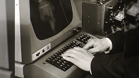 Circa 1980s Early Computer Programer Mainframe Hands Keyboard Vintage Film Stock Footage 153818234