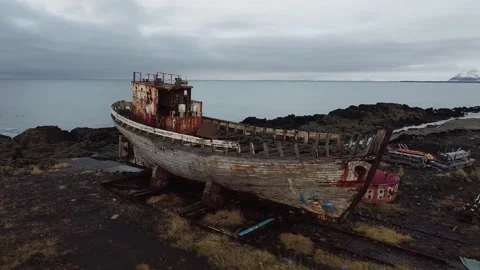 Circle around an Abandoned Rusty Ship Wreck on a rocky beach in Iceland 2K Video Video stock 145484918