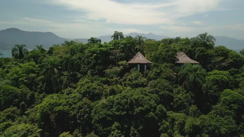 Circle Around Two Private Huts, Mountain Top, Oceanfront Helipad, 4k Stock Footage 239686229