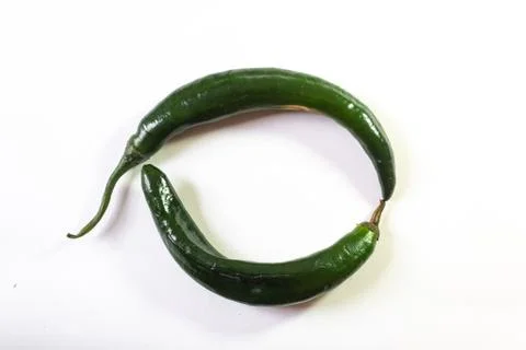 Circle background formed by two chilaca peppers, creative copy space Stock Photos